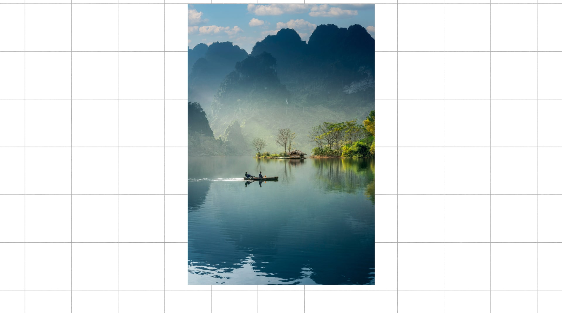 Image of a lake, after editing, adding a kayak in the middle of the lake, photo enhancing services